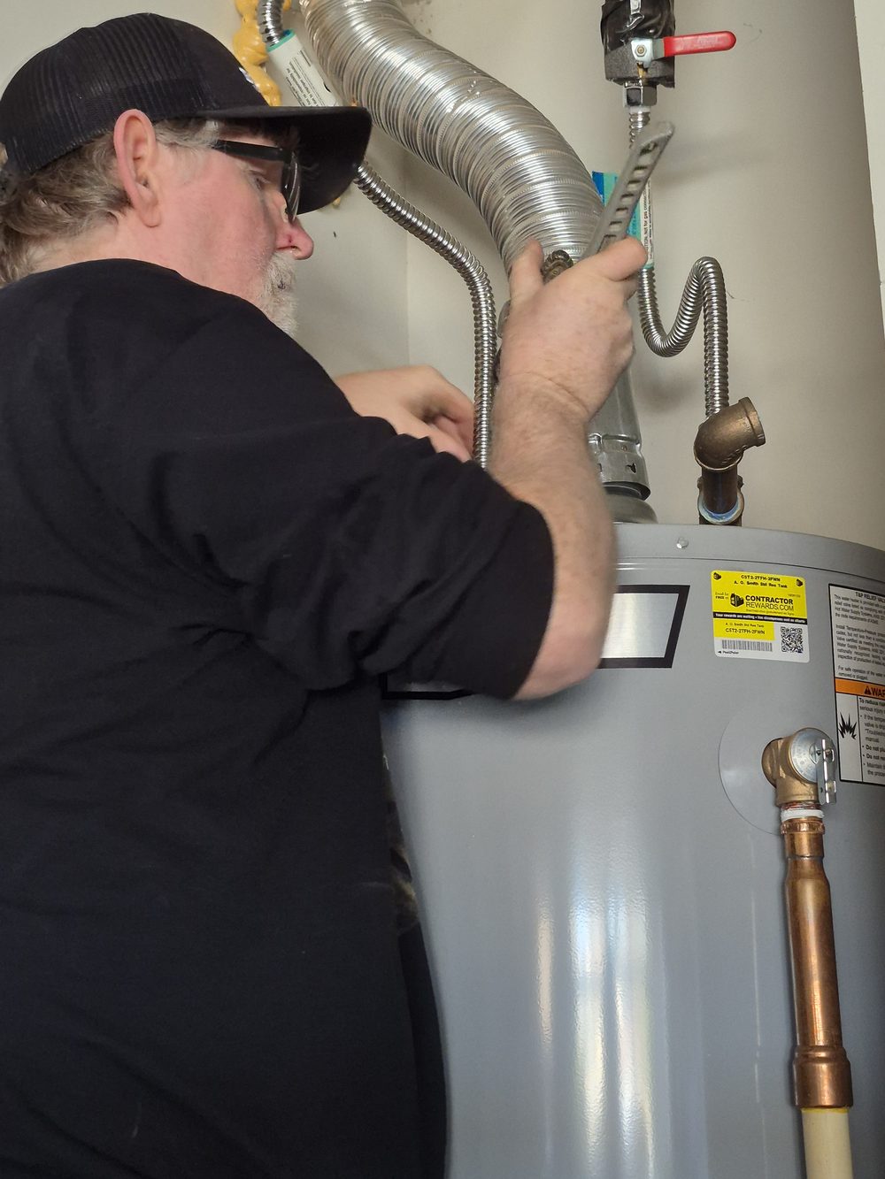 Mark The Plumber servicing a water heater in Lampasas TX — Licensed Master Plumber RMP#45578